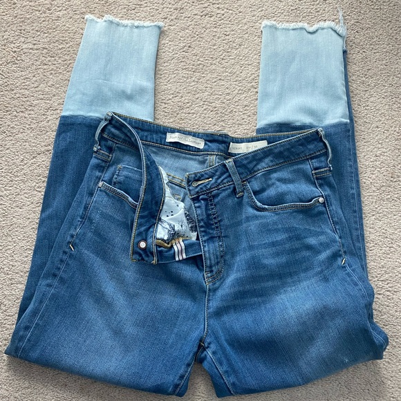 Distresses ankle bottom with a lighter color denim on back. Script - Picture 3 of 5